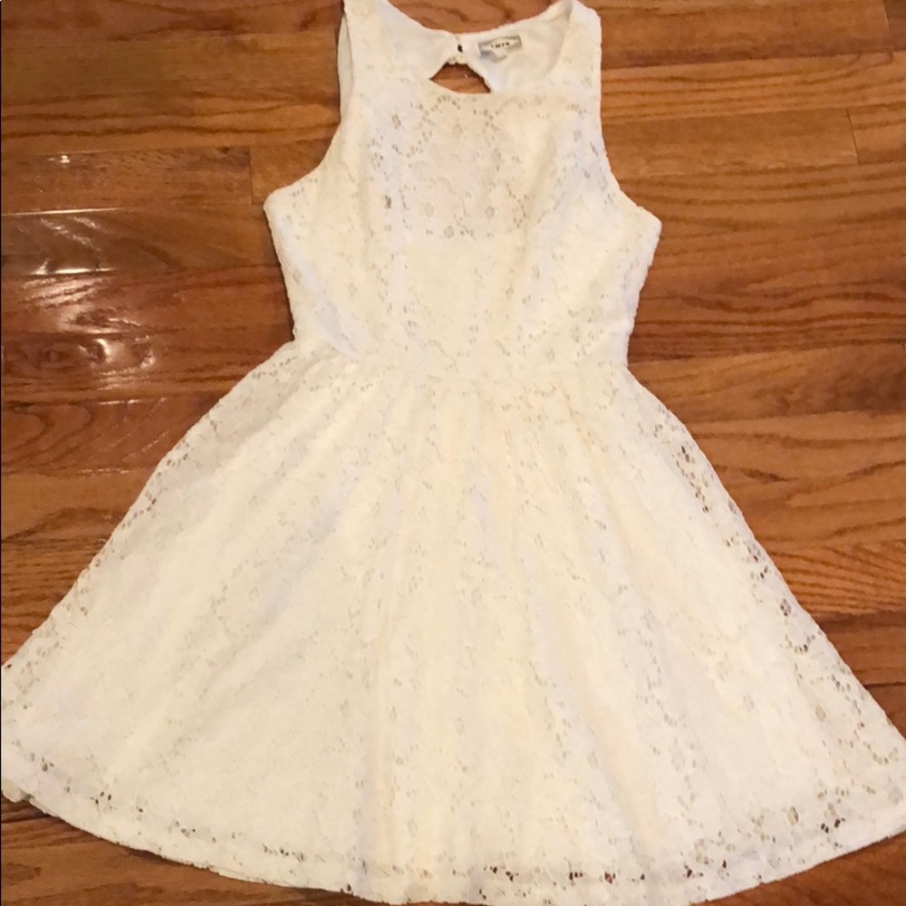 Cream lace dress with cut out back.